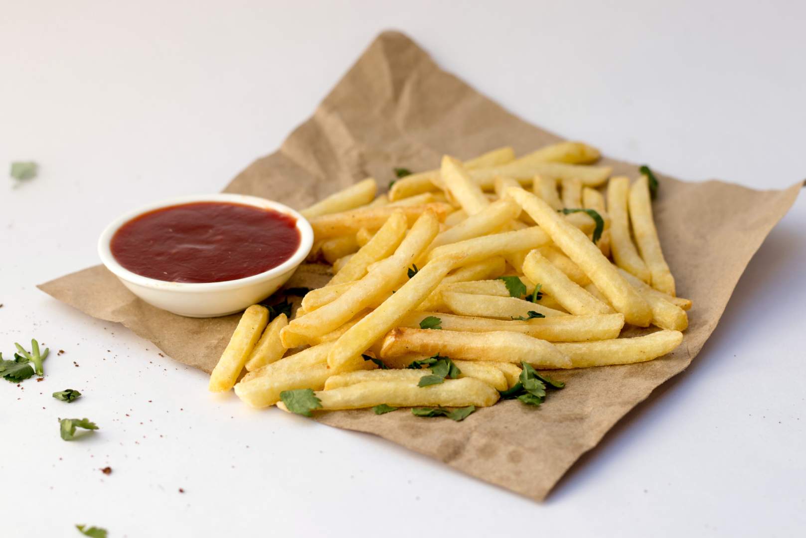 A close up of some fries on a paper