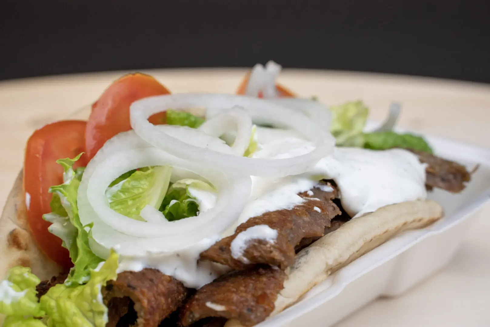 A plate of food with meat and vegetables on it.